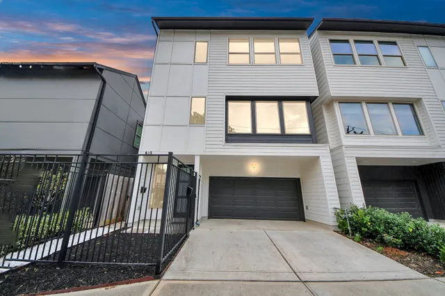 a front view of a house with garage