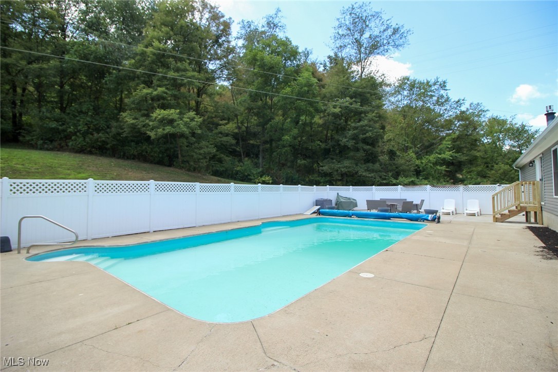 1798 Campbell Road Southwest New Philadelphia, OH 44663 - Photo 37 of 50 View of pool featuring a patio