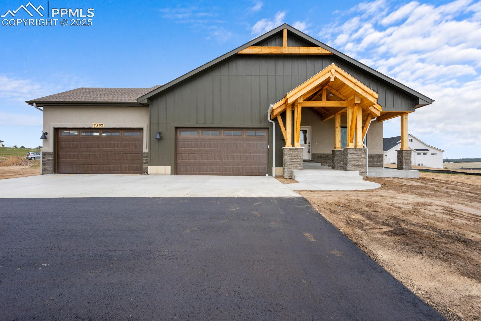 11762 Rambling Road Colorado Springs, CO 80908 - Photo 1 of 42 Front elevation with beautiful covered porch