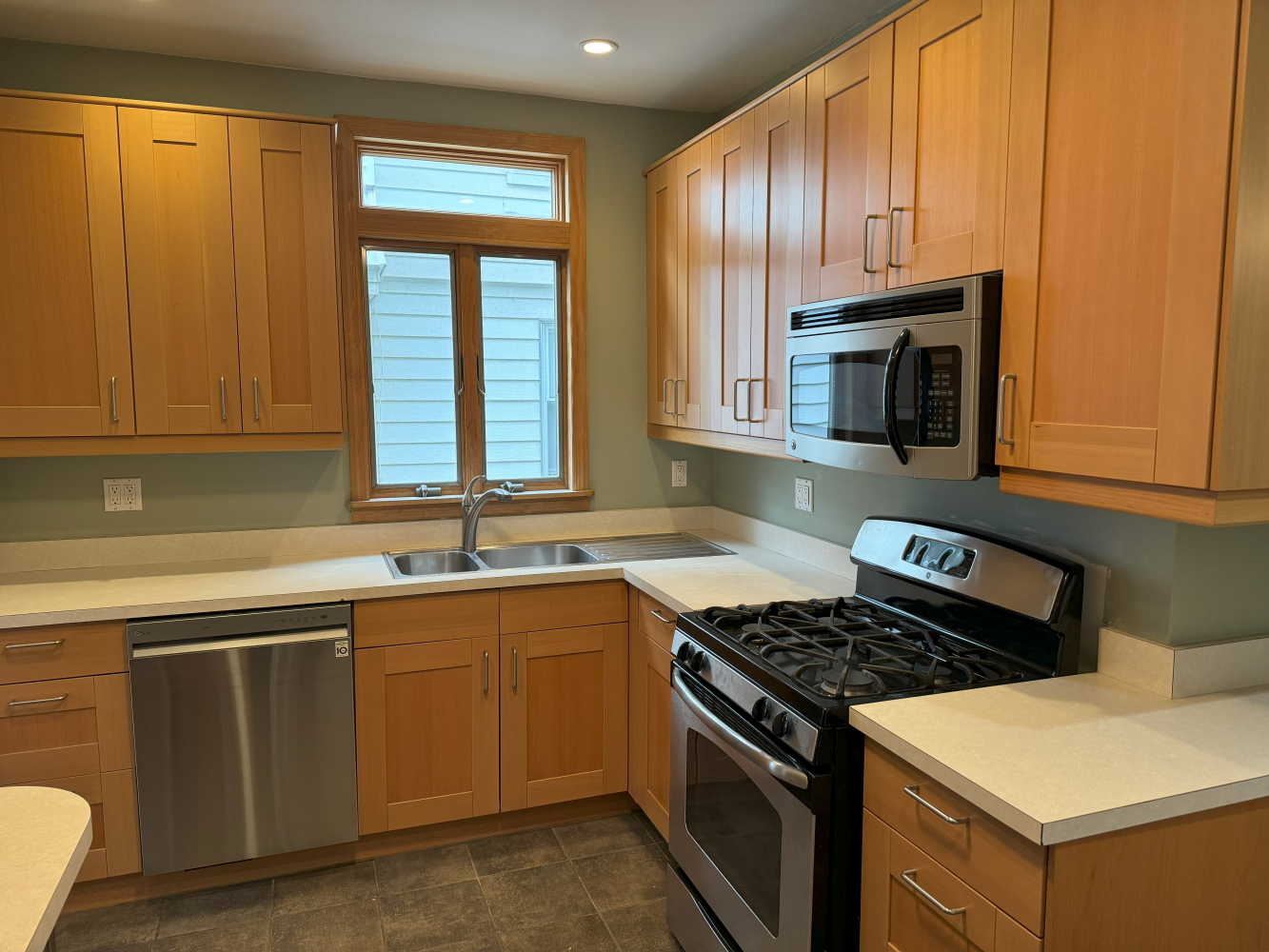 2024 Glenwood Road Brooklyn, NY 11210 - Photo 8 of 13 a kitchen with granite countertop stainless steel appliances a sink stove and cabinets