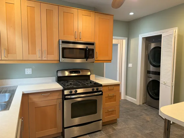a kitchen with a stove and a microwave