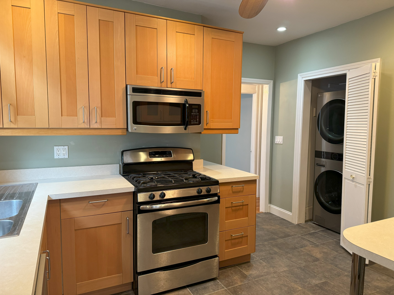 2024 Glenwood Road Brooklyn, NY 11210 - Photo 9 of 13 a kitchen with a stove and a microwave