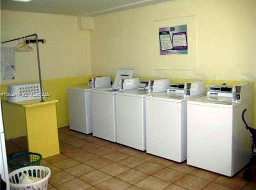 7840 Southwest 55th Avenue, Unit 22A Miami, FL 33143 - Photo 13 of 16 a utility room with dryer and washer