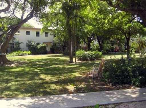 7840 Southwest 55th Avenue, Unit 22A Miami, FL 33143 - Photo 16 of 16 a view of a house with a yard