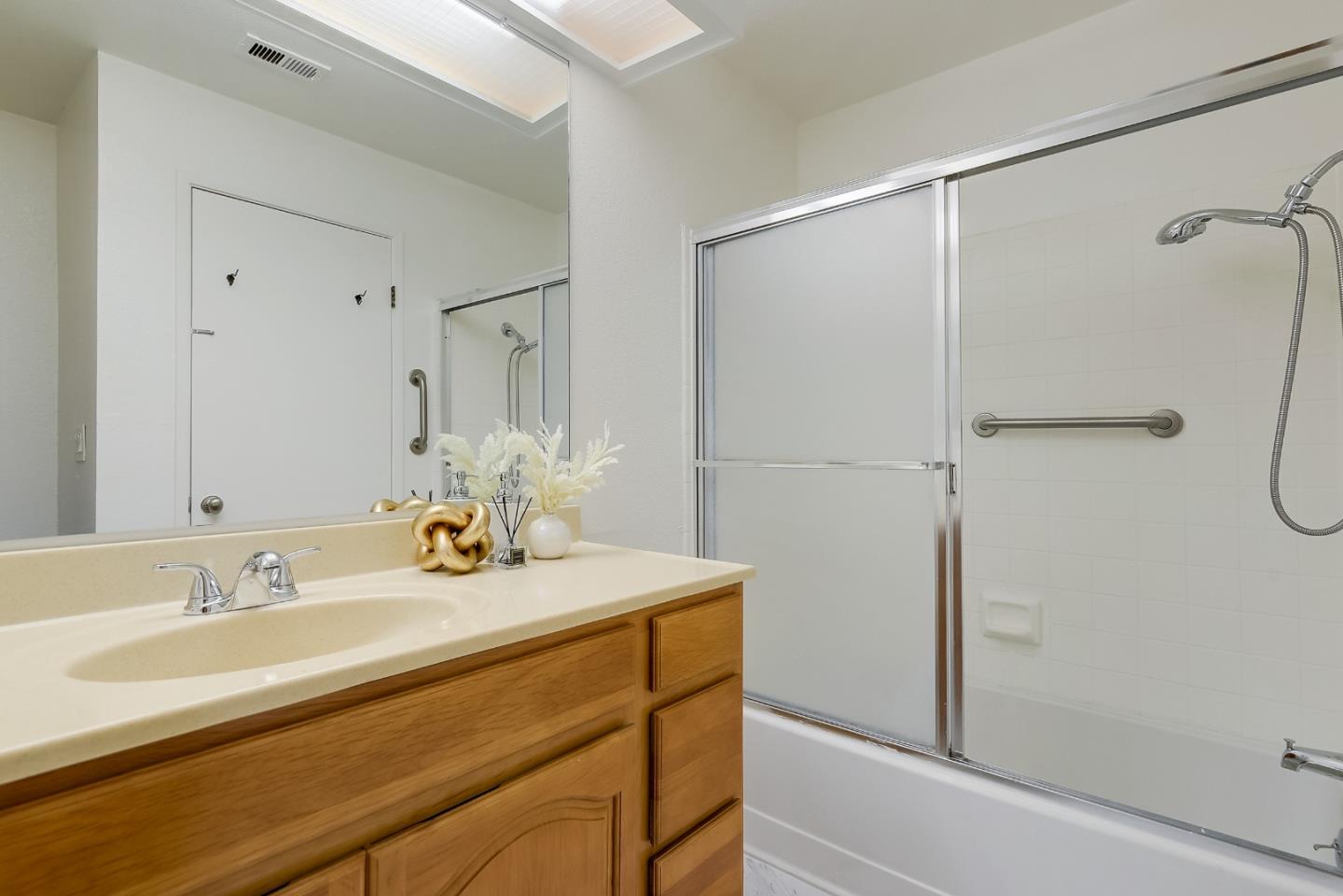 1400 Bowe Avenue, Unit 302 Santa Clara, CA 95051 - Photo 11 of 16 a bathroom with a sink and a mirror