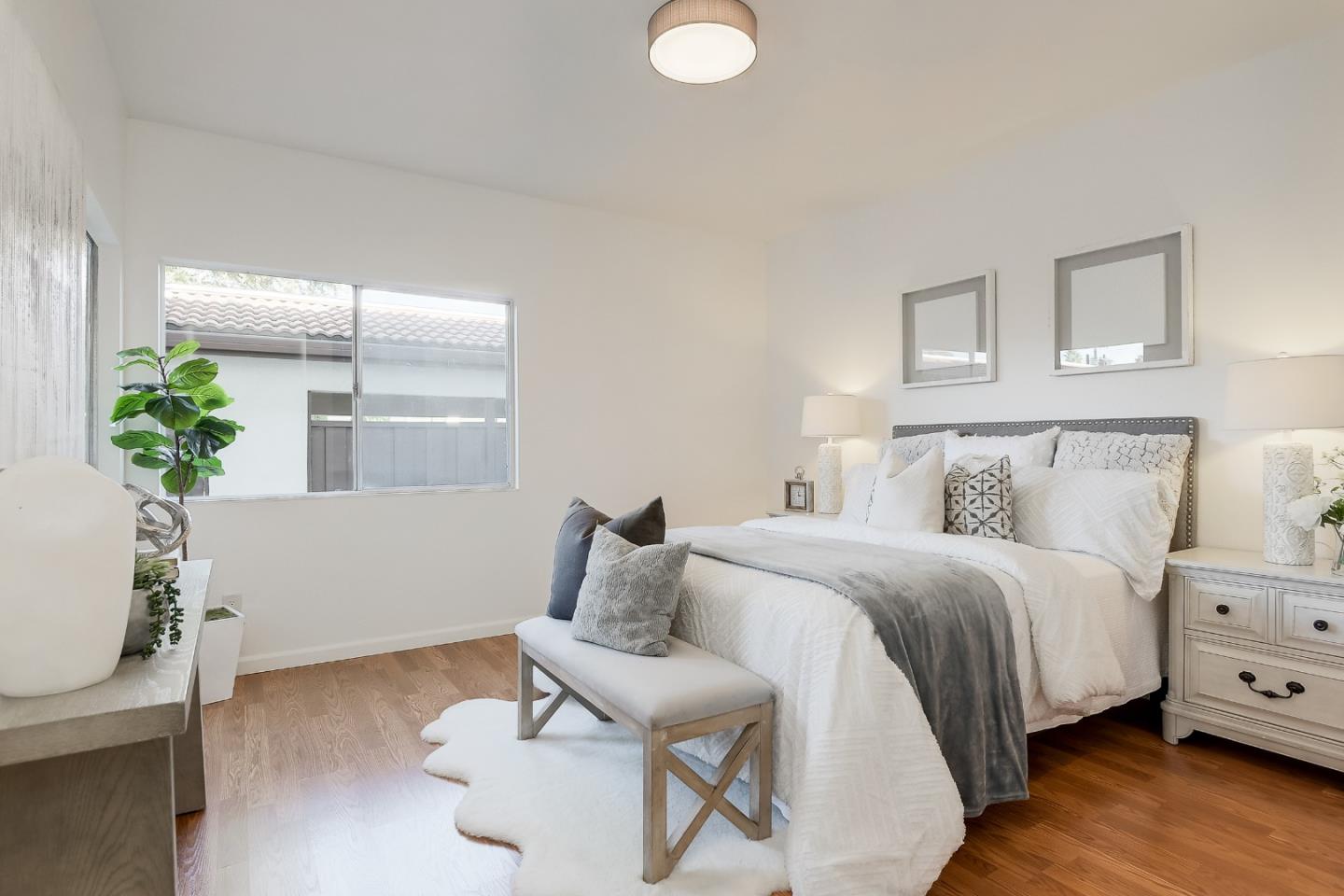 1400 Bowe Avenue, Unit 302 Santa Clara, CA 95051 - Photo 7 of 16 a bed room with a bed and a potted plant