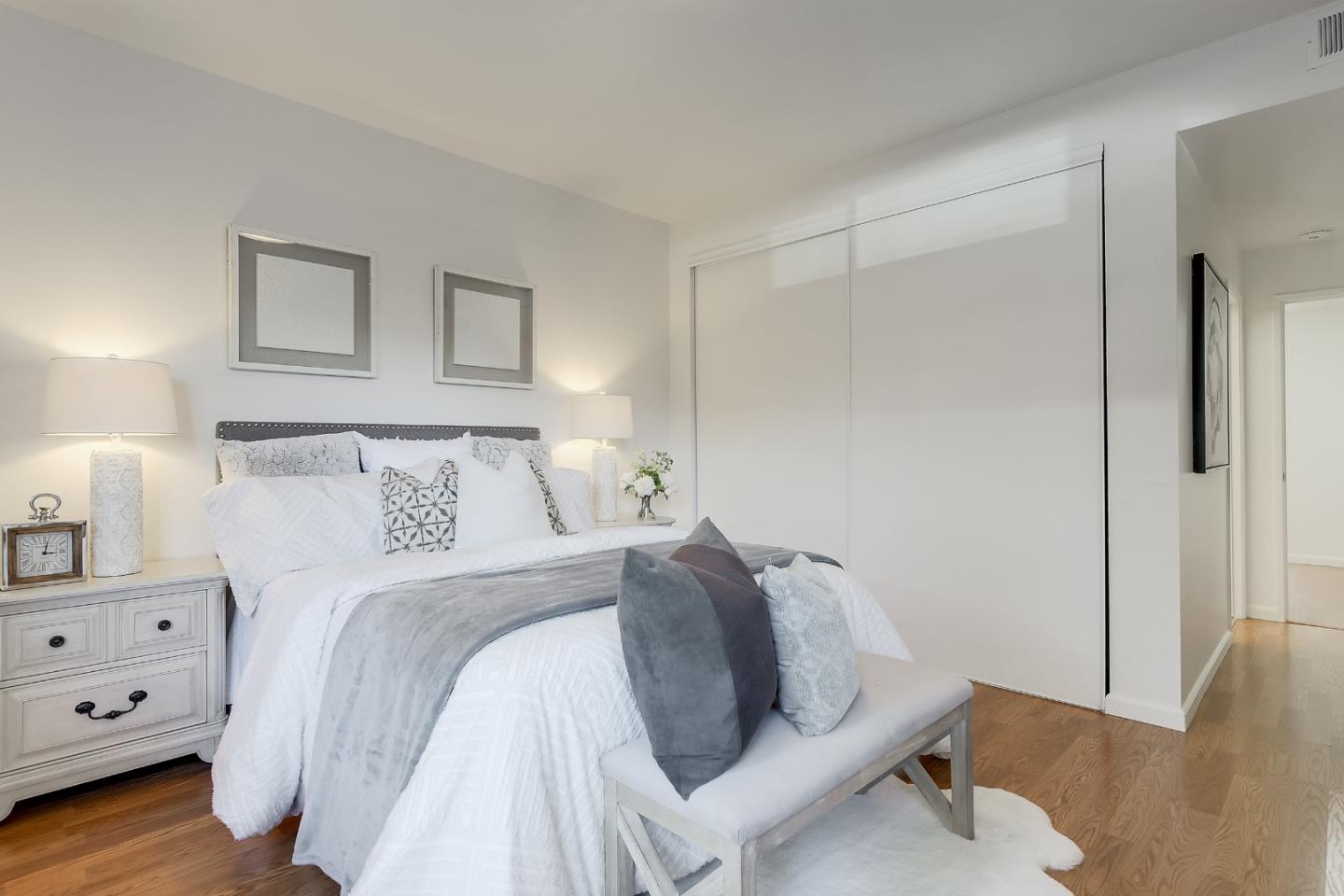 1400 Bowe Avenue, Unit 302 Santa Clara, CA 95051 - Photo 8 of 16 a bed room with a bed and a couch