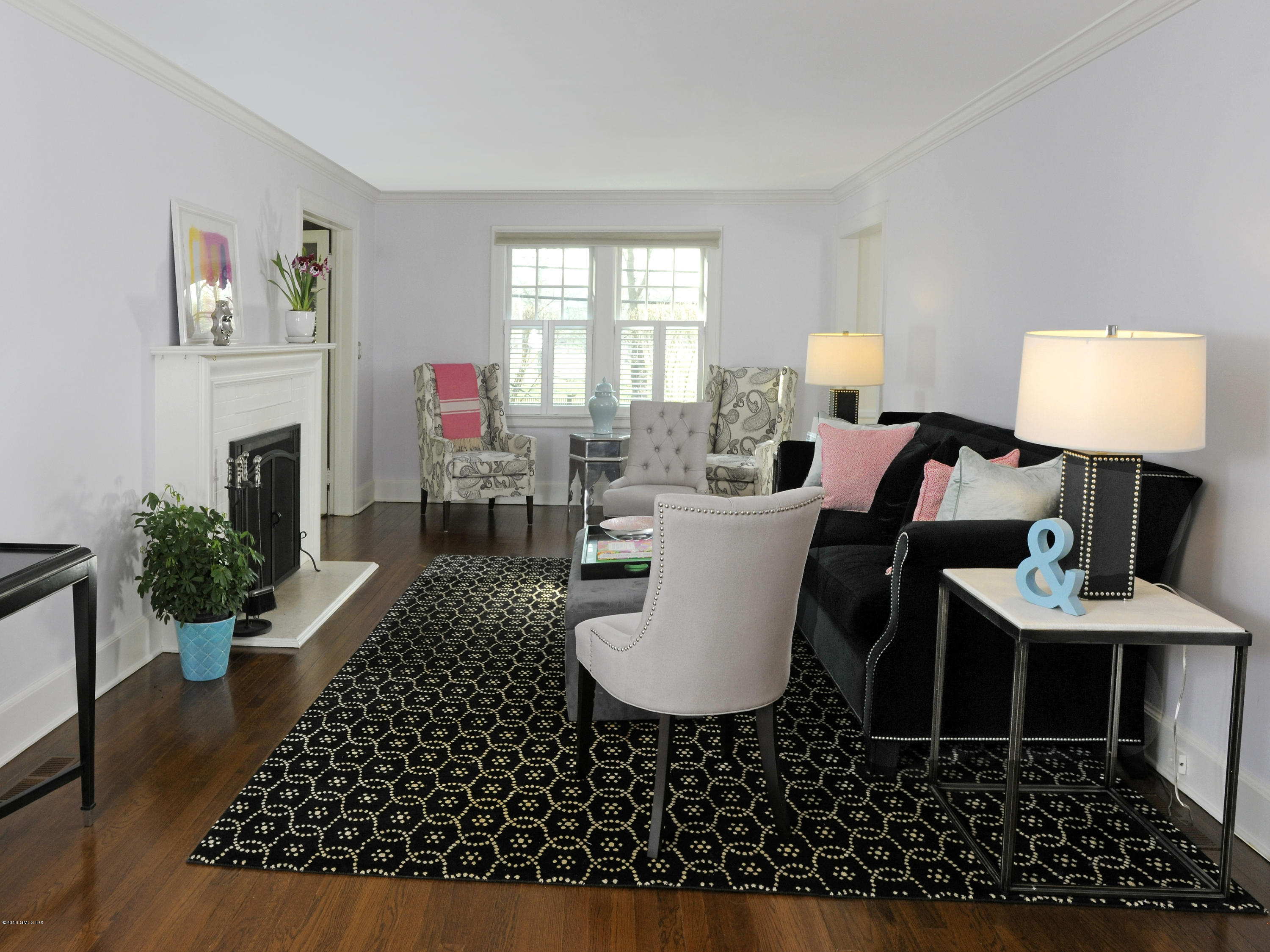 63 Indian Field Road Greenwich, CT 06830 - Photo 4 of 37 a living room with furniture a fireplace and a table