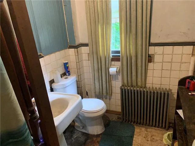 a bathroom with a sink and a toilet