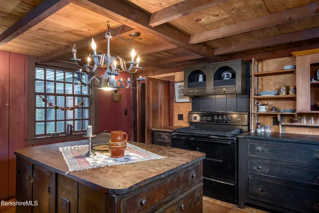a kitchen with a stove and a refrigerator