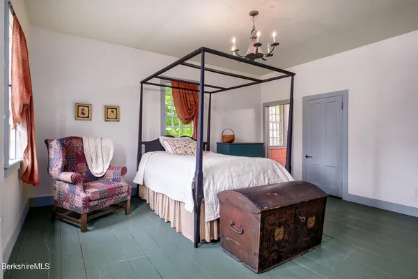 a bed room with a bed and a window