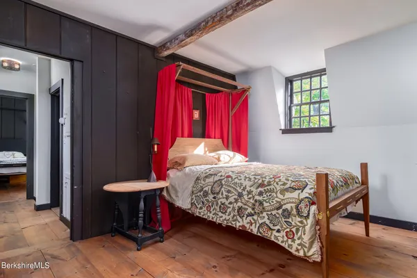 a bedroom with a bed and a closet