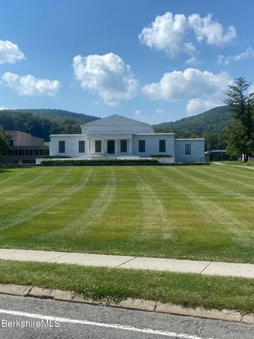 a view of a town with mountains in the background