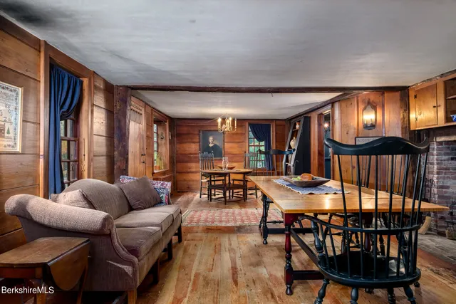 a dining room with furniture and window