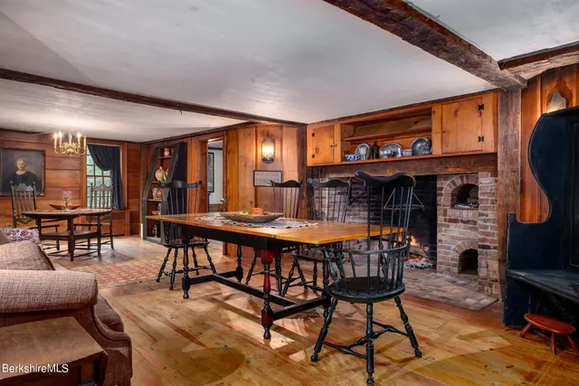 a dining room with furniture and a fireplace