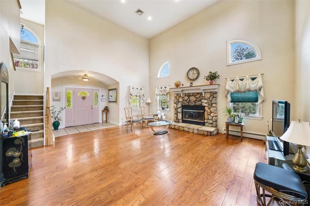 2 Bruyn Avenue Pine Bush, NY 12566 - Photo 6 of 9 a view of a livingroom with furniture a fireplace and wooden floor