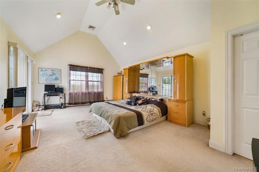 2 Bruyn Avenue Pine Bush, NY 12566 - Photo 7 of 9 a spacious bedroom with a bed a couch and large window