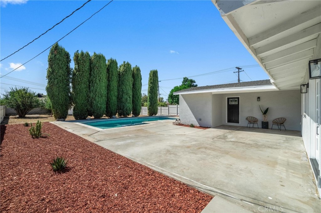 4386 Monroe Street Riverside, CA 92503 - Photo 1 of 1 a view of a house with backyard and trees