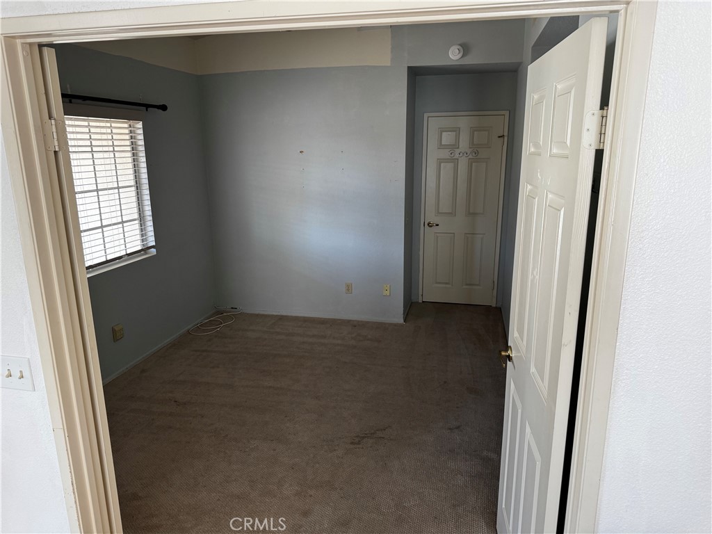27519 Terrytown Road Menifee, CA 92586 - Photo 16 of 22 an empty room with windows