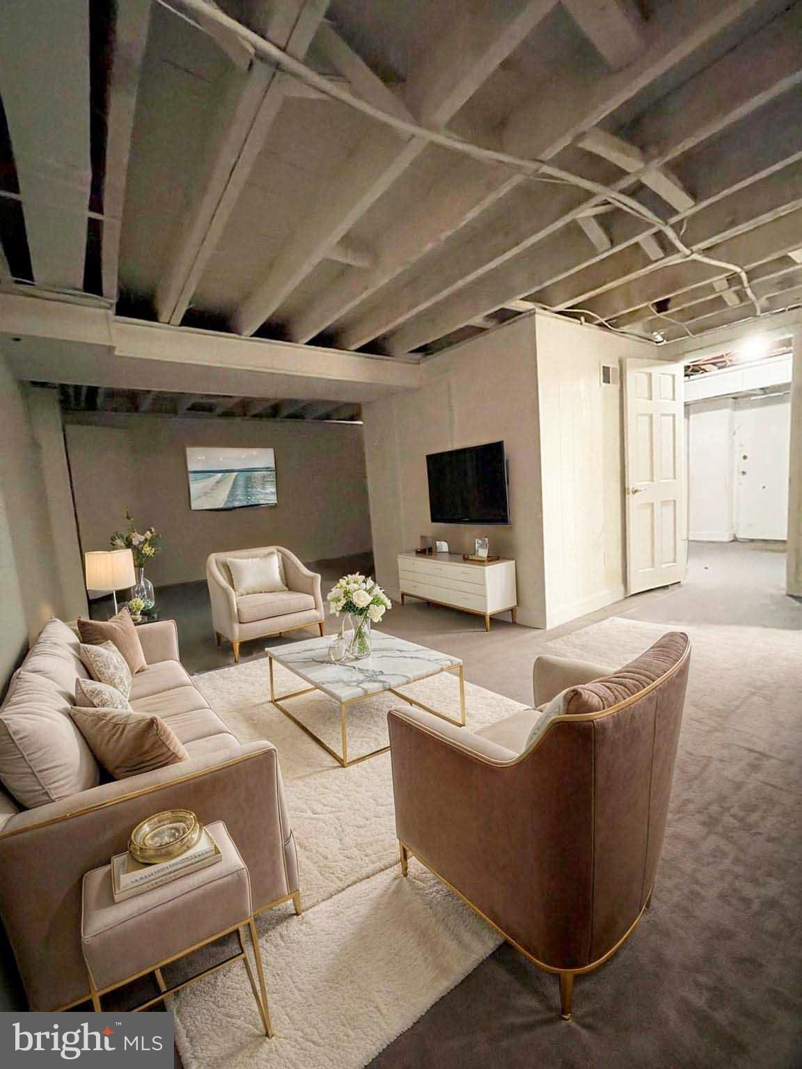 3609 Brooklyn Avenue Baltimore, MD 21225 - Photo 19 of 41 a living room with furniture and a flat screen tv