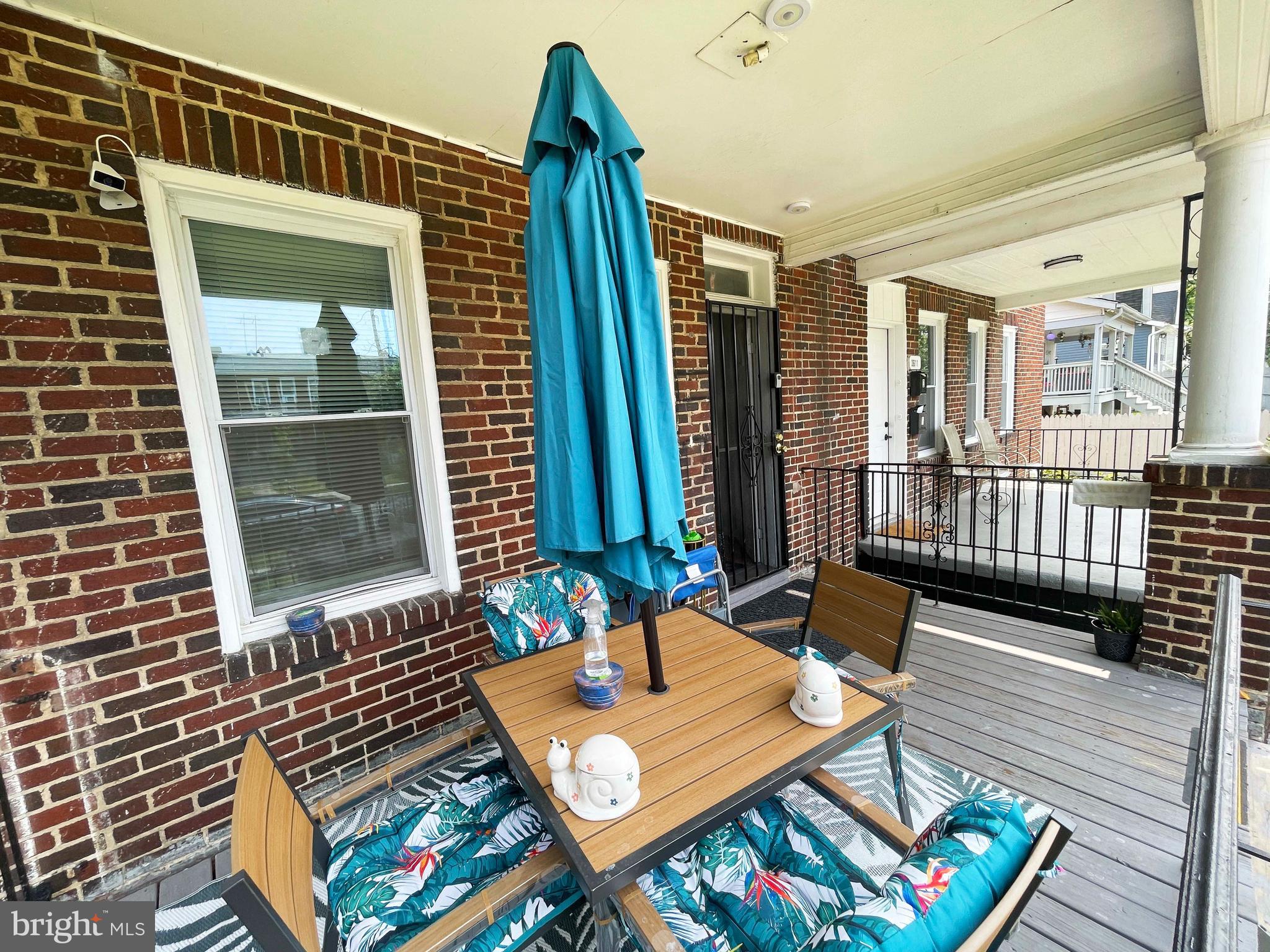 3609 Brooklyn Avenue Baltimore, MD 21225 - Photo 2 of 41 a view of balcony with two chairs and a table