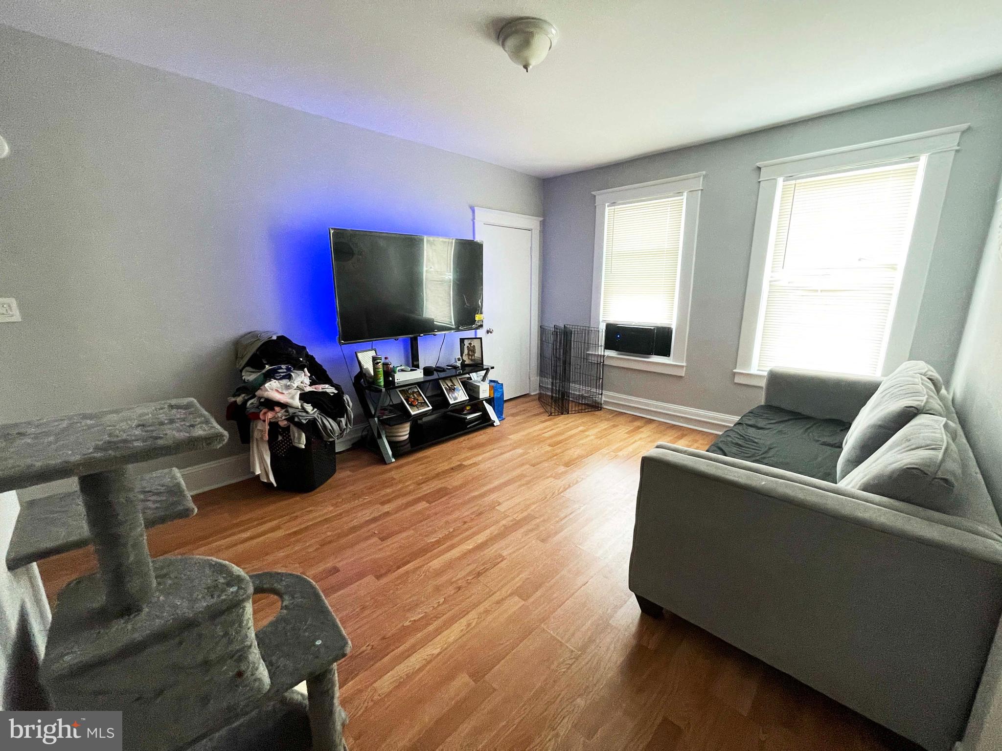 3609 Brooklyn Avenue Baltimore, MD 21225 - Photo 27 of 41 a living room with furniture and a flat screen tv