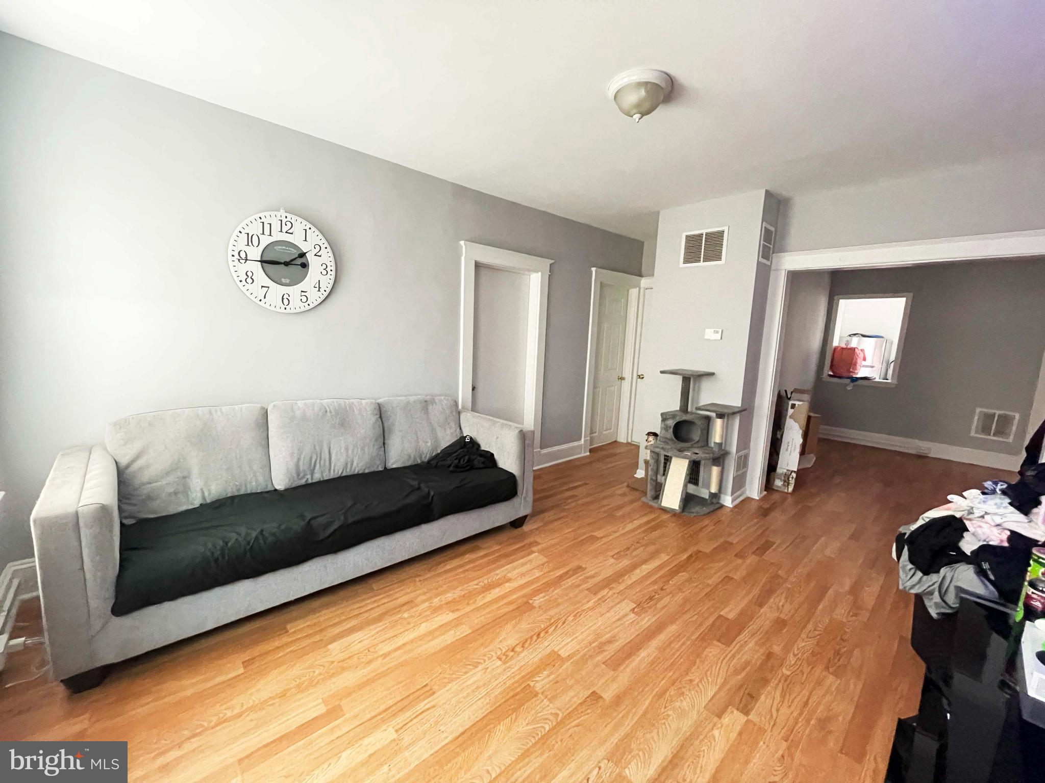 3609 Brooklyn Avenue Baltimore, MD 21225 - Photo 28 of 41 a living room with furniture and wooden floor