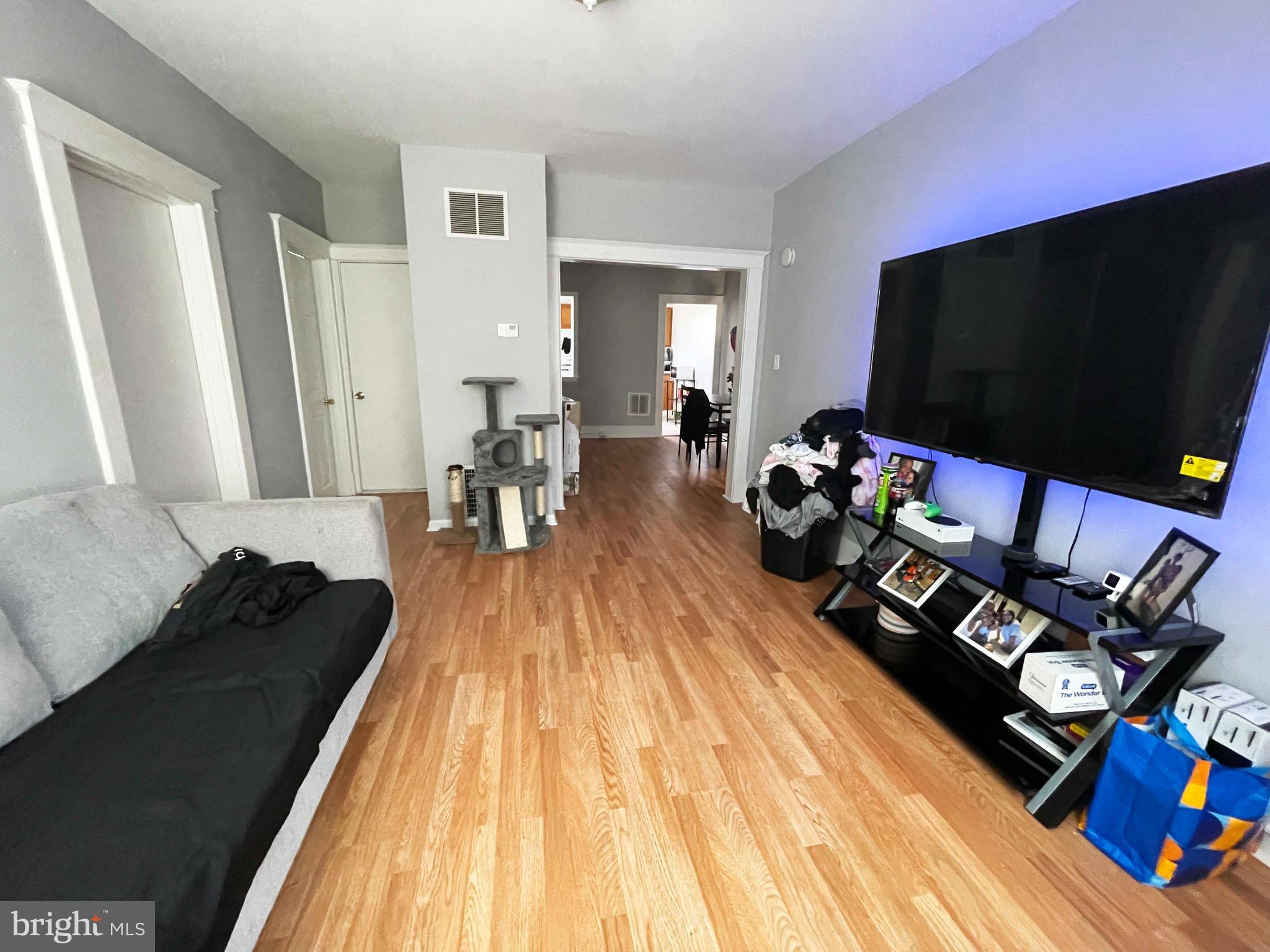 3609 Brooklyn Avenue Baltimore, MD 21225 - Photo 29 of 41 a living room with furniture and a flat screen tv