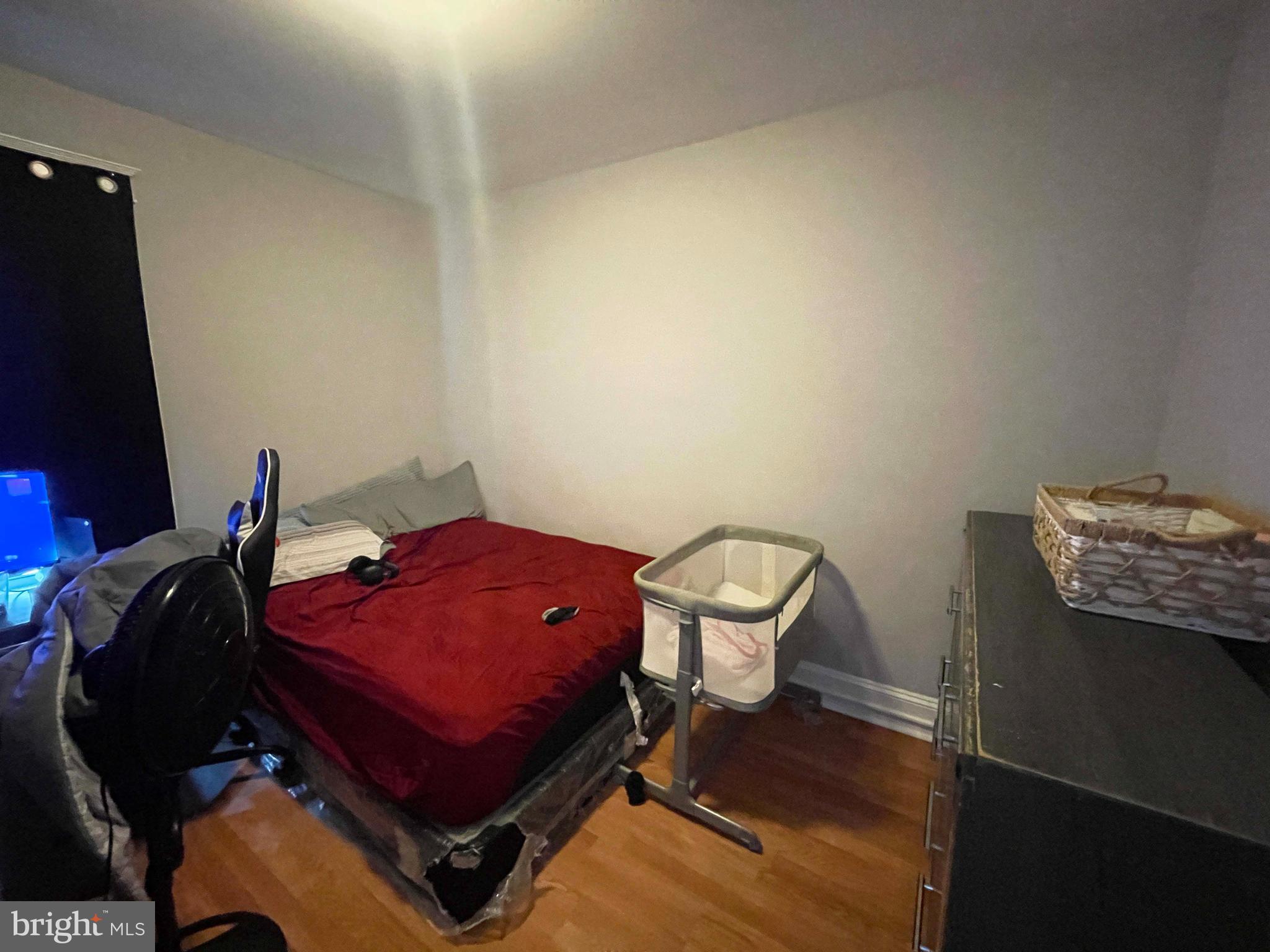 3609 Brooklyn Avenue Baltimore, MD 21225 - Photo 33 of 41 a room with a chair and a air conditioner vent