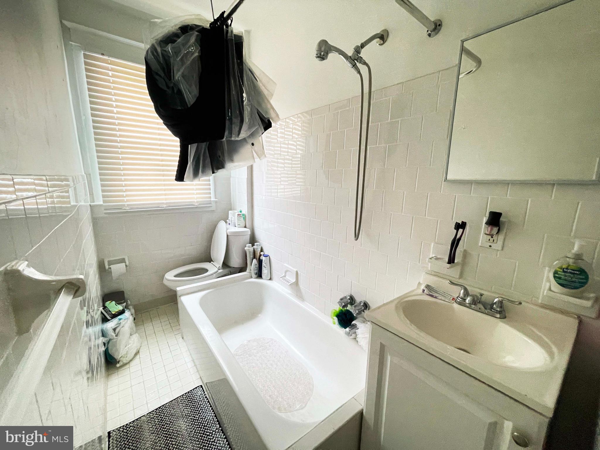 3609 Brooklyn Avenue Baltimore, MD 21225 - Photo 37 of 41 a bathroom with a sink and a toilet