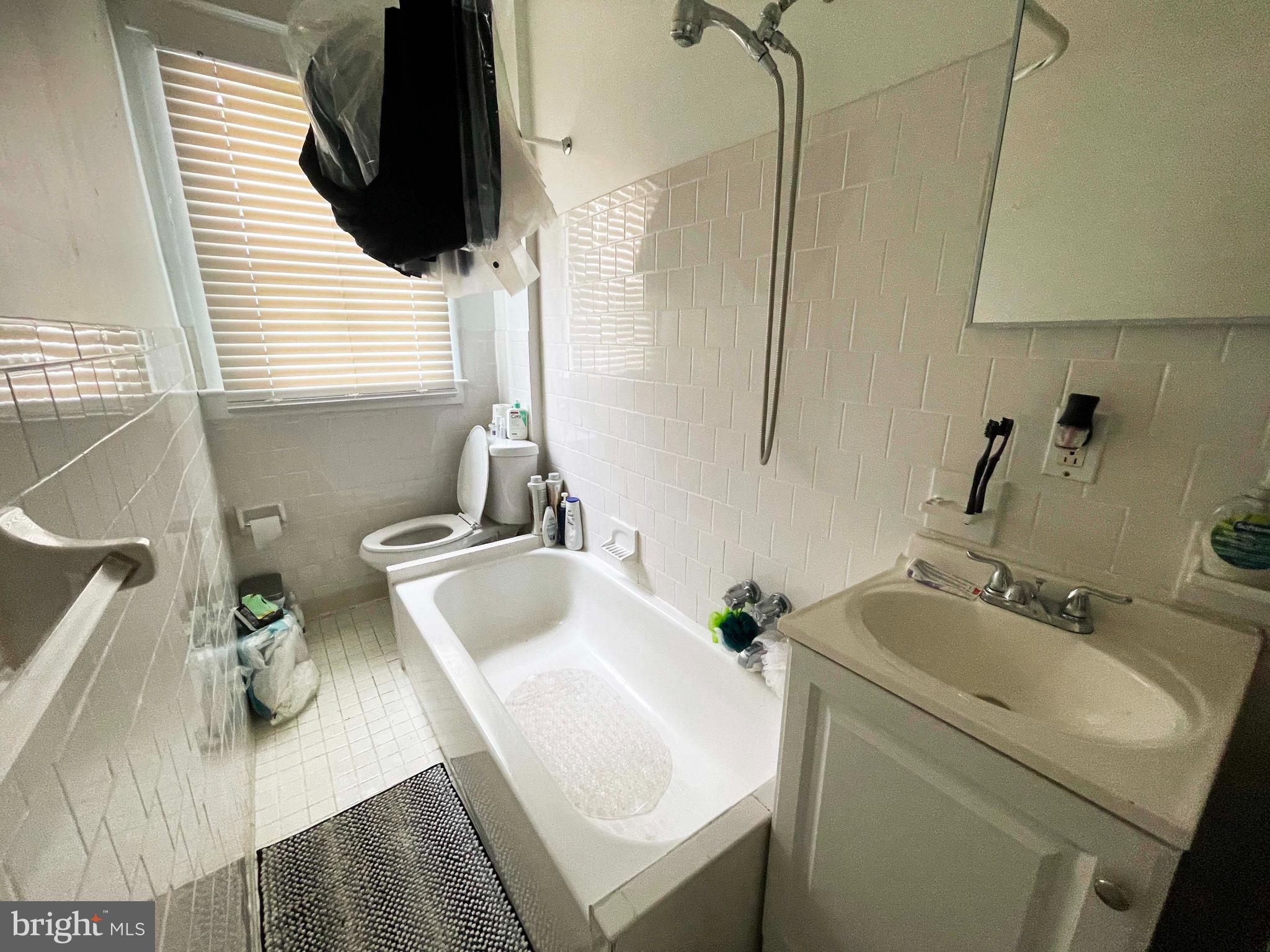 3609 Brooklyn Avenue Baltimore, MD 21225 - Photo 39 of 41 a bathroom with a sink and a toilet