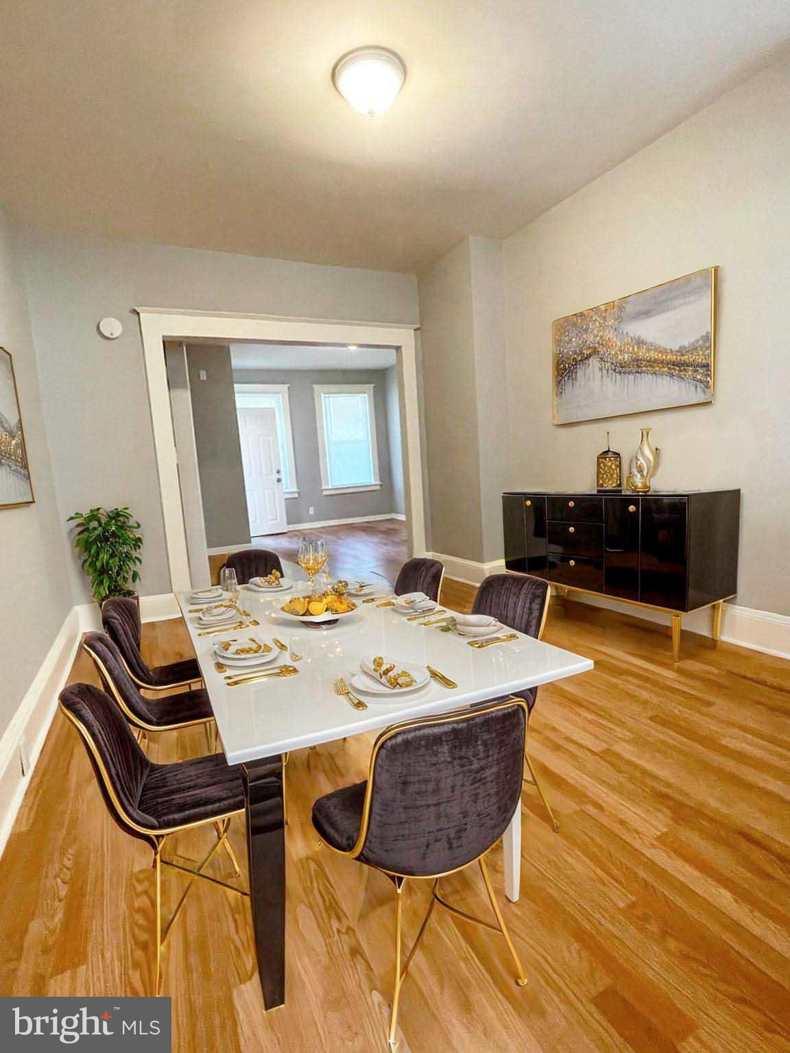 3609 Brooklyn Avenue Baltimore, MD 21225 - Photo 9 of 41 a dining room with a table and chairs