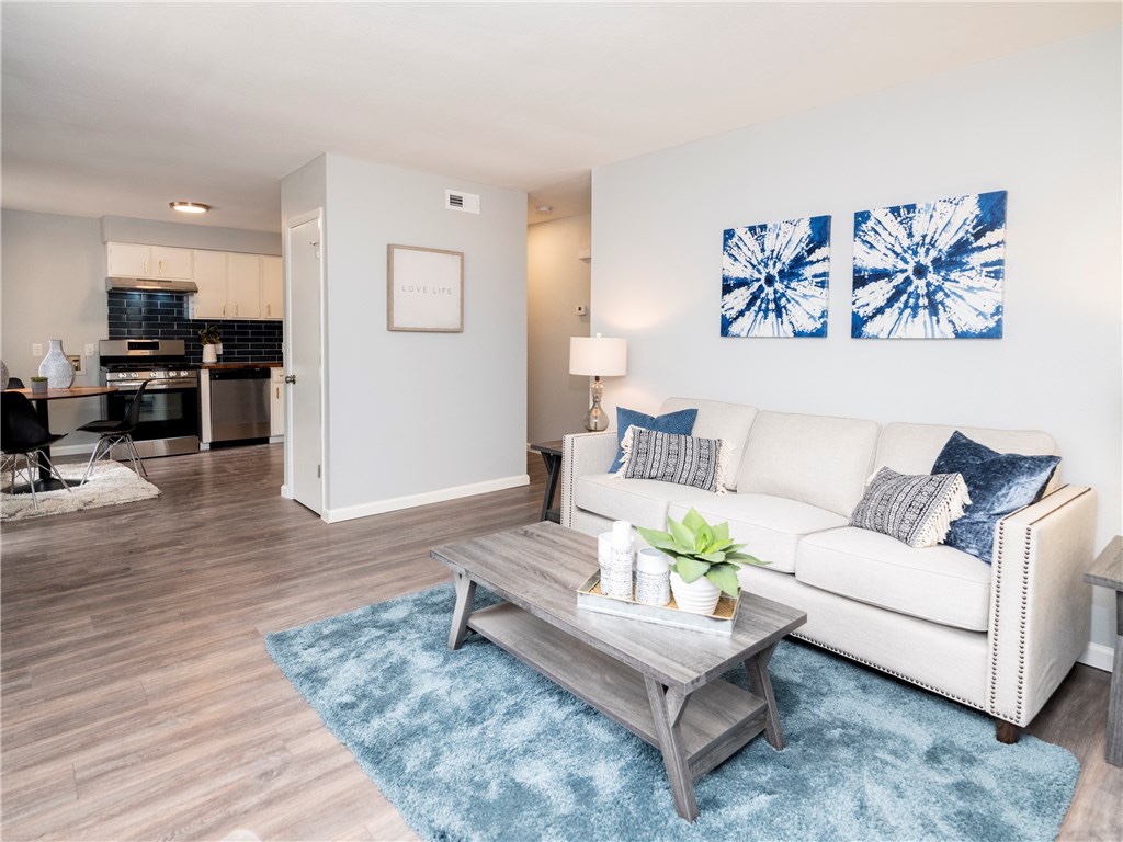 7004 Circle S Road, Unit B Austin, TX 78745 - Photo 8 of 12 An open concept living area boasts a modern kitchen and inviting lounge space.