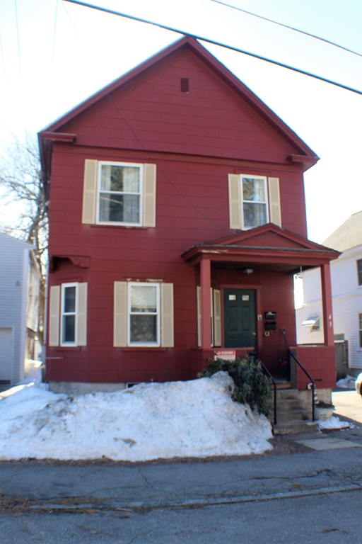 43 Farmland Road Lowell, MA 01850 - Photo 1 of 27 a front view of a house with garden