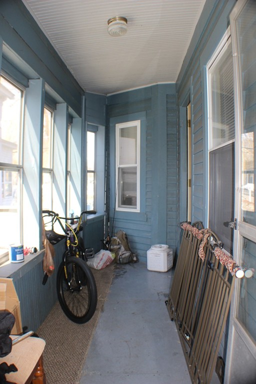 43 Farmland Road Lowell, MA 01850 - Photo 13 of 27 a view of a room with furniture and windows