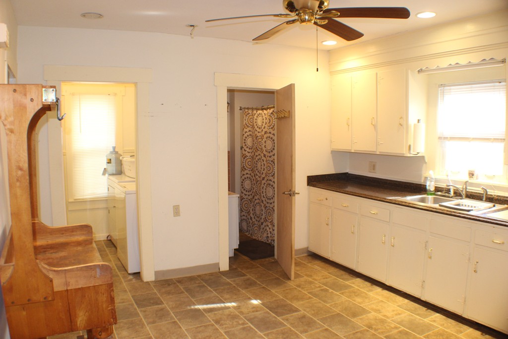 43 Farmland Road Lowell, MA 01850 - Photo 14 of 27 a view of a kitchen with a sink and cabinets