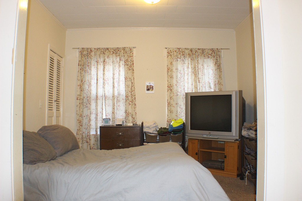 43 Farmland Road Lowell, MA 01850 - Photo 18 of 27 a bedroom with a bed and a flat screen tv