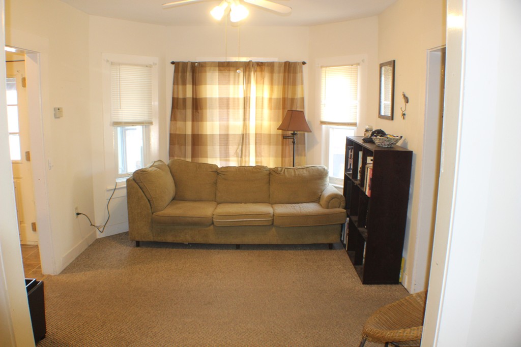 43 Farmland Road Lowell, MA 01850 - Photo 20 of 27 a living room with furniture and a large window