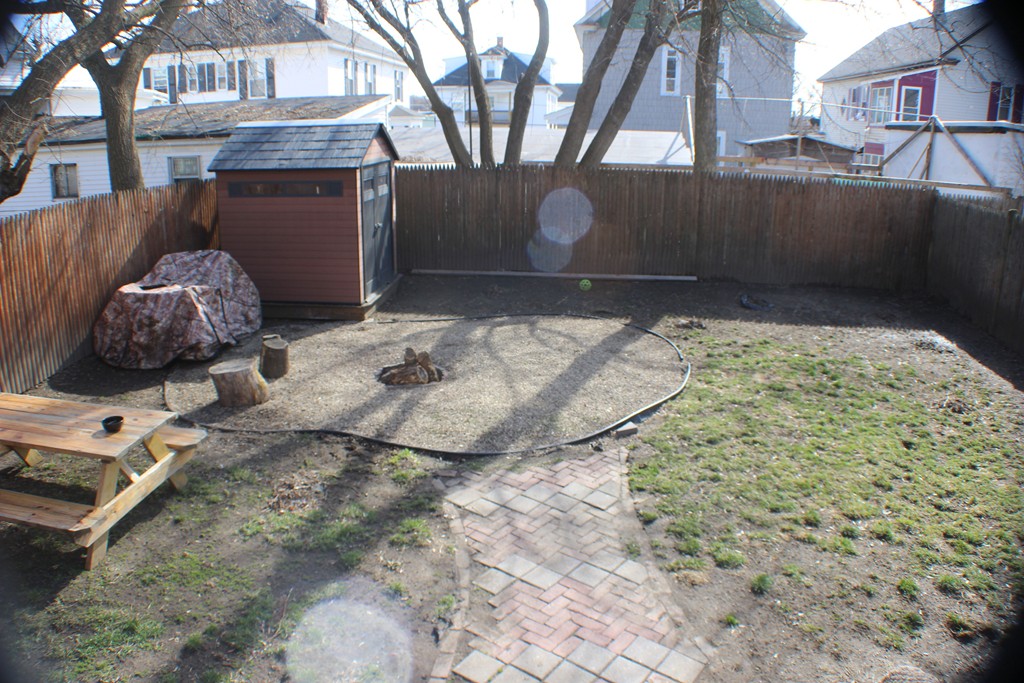 43 Farmland Road Lowell, MA 01850 - Photo 22 of 27 a view of a backyard of the house