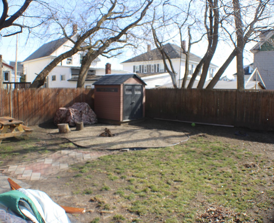 43 Farmland Road Lowell, MA 01850 - Photo 23 of 27 a view of a backyard of the house