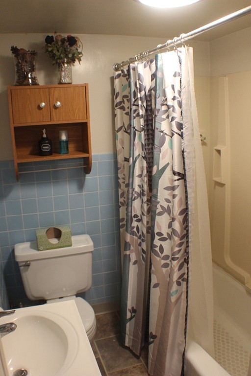 43 Farmland Road Lowell, MA 01850 - Photo 8 of 27 a bathroom with a toilet and shower