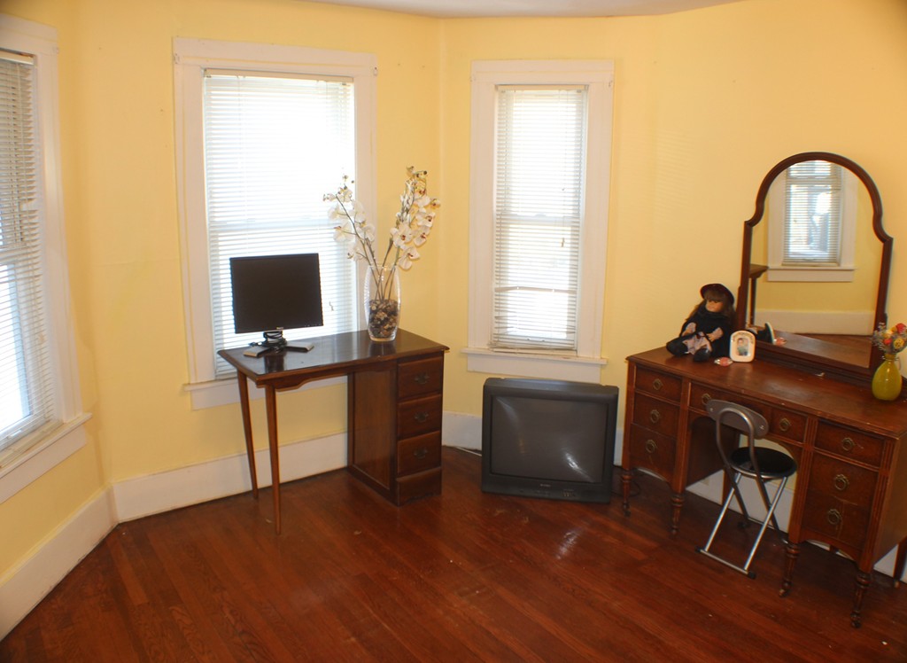 43 Farmland Road Lowell, MA 01850 - Photo 10 of 27 a view of a workspace with furniture and a window