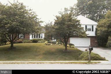 18808 Bloomfield Road Olney, MD 20832 - Photo 1 of 2 a front view of a house with garden