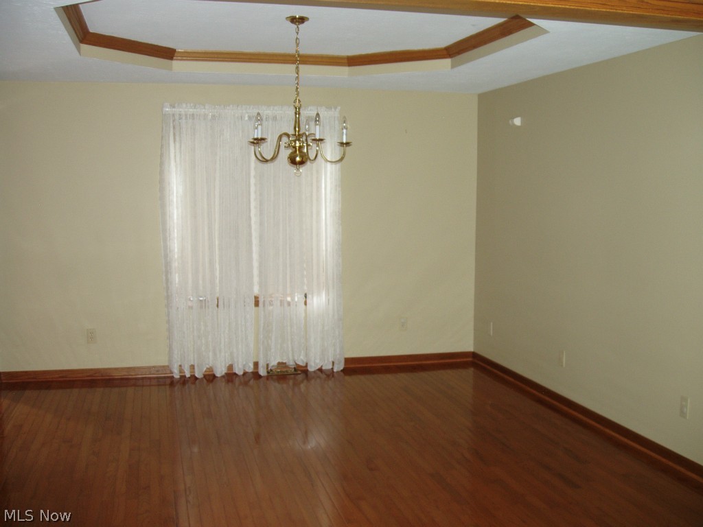 13132 Whitney Road Strongsville, OH 44136 - Photo 5 of 21 Dining Room with tray ceiling & wood floors