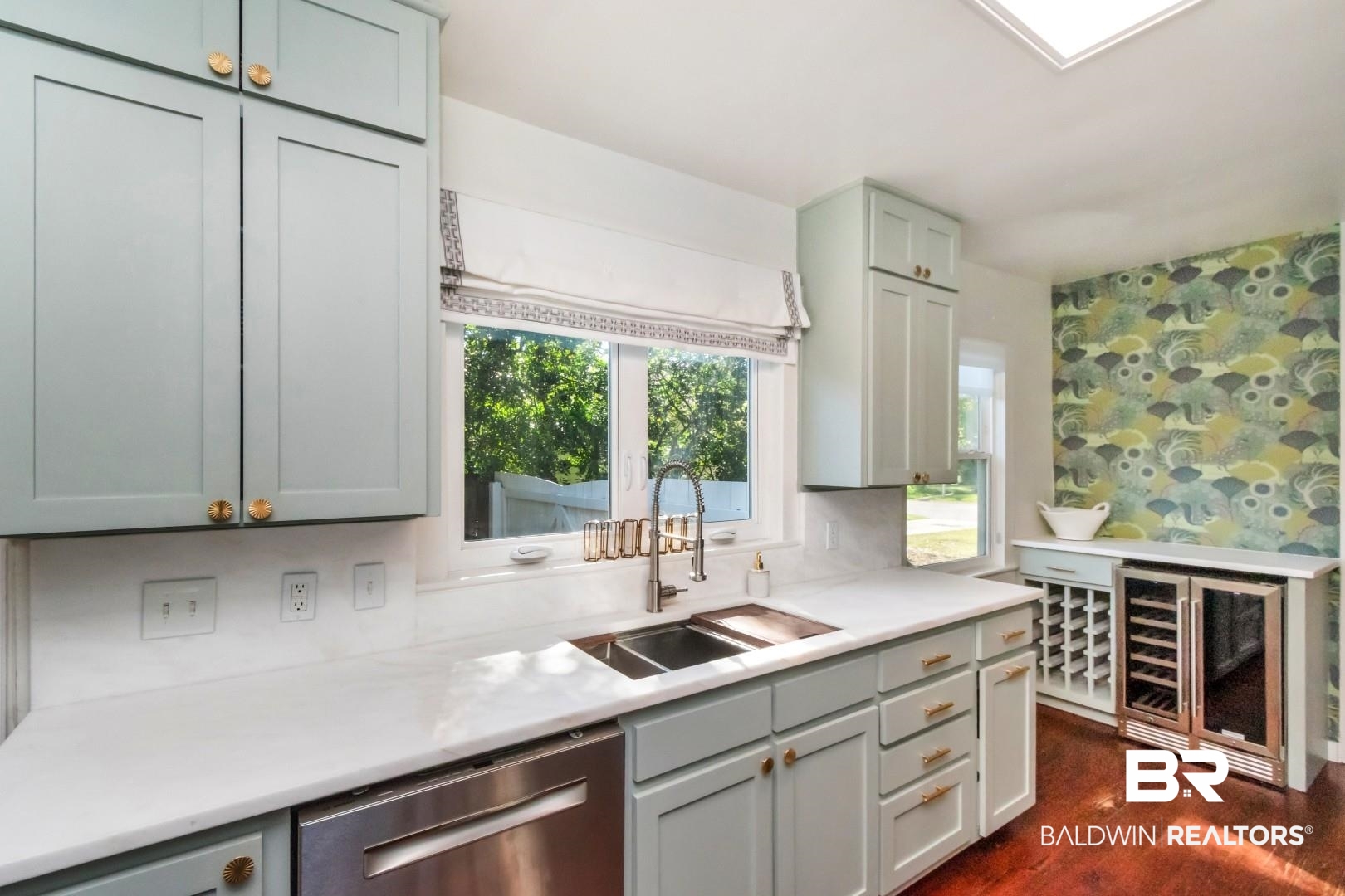 18 Princess Anne Road Mobile, AL 36608 - Photo 14 of 41 Kitchen with beverage cooler, dishwasher, dark wood-style floors, wallpapered walls, and light stone counters