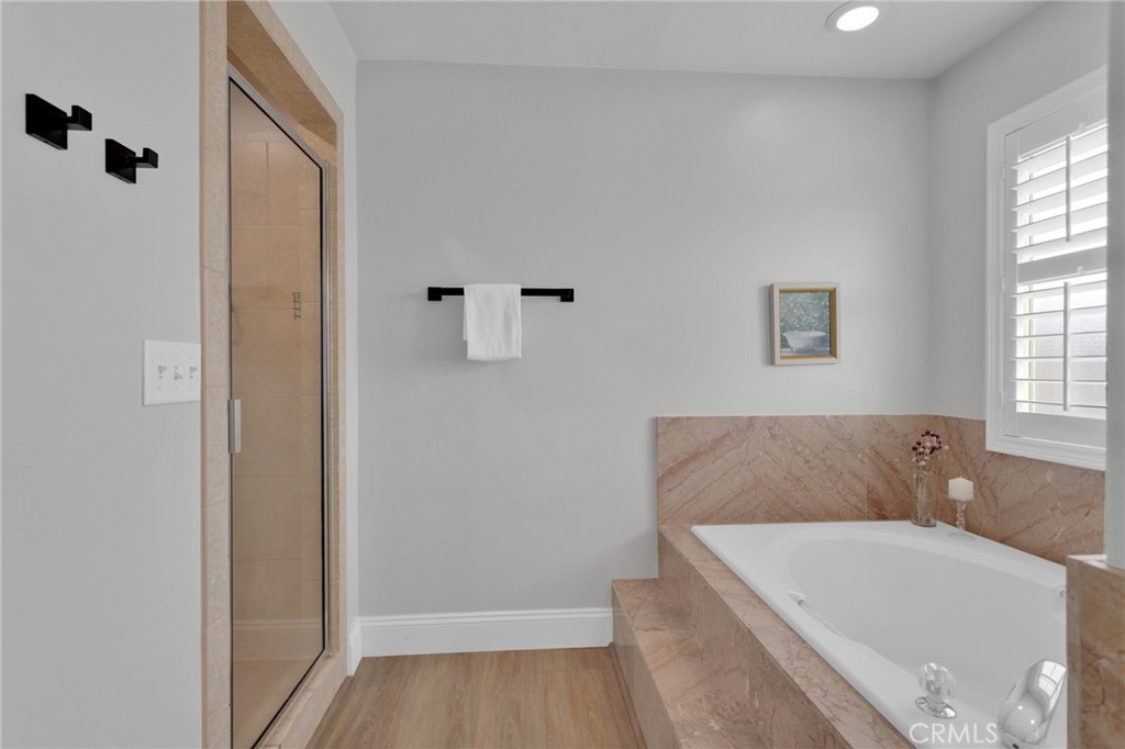 11410 Cibola Road Apple Valley, CA 92308 - Photo 23 of 45 a bathroom with a tub and shower