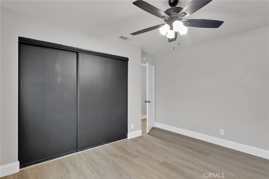 11410 Cibola Road Apple Valley, CA 92308 - Photo 28 of 45 a view of an empty room with a ceiling fan