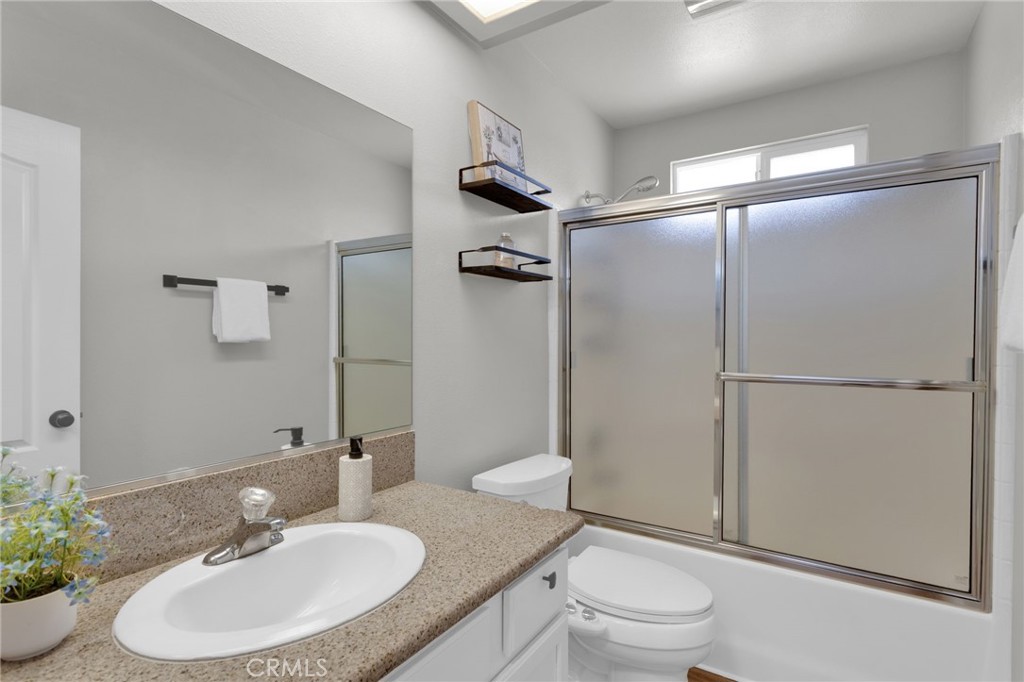 11410 Cibola Road Apple Valley, CA 92308 - Photo 29 of 45 a bathroom with a sink toilet and shower