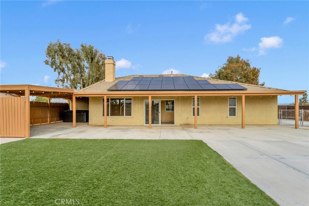 11410 Cibola Road Apple Valley, CA 92308 - Photo 34 of 45 a front view of a house with a garden