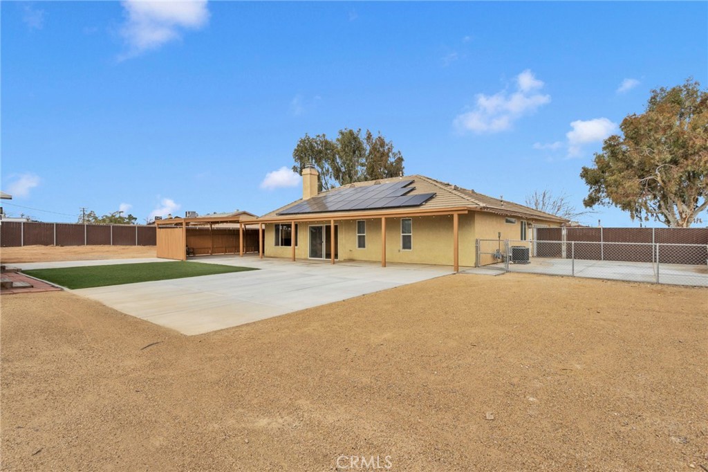 11410 Cibola Road Apple Valley, CA 92308 - Photo 38 of 45 a front view of a house with a yard